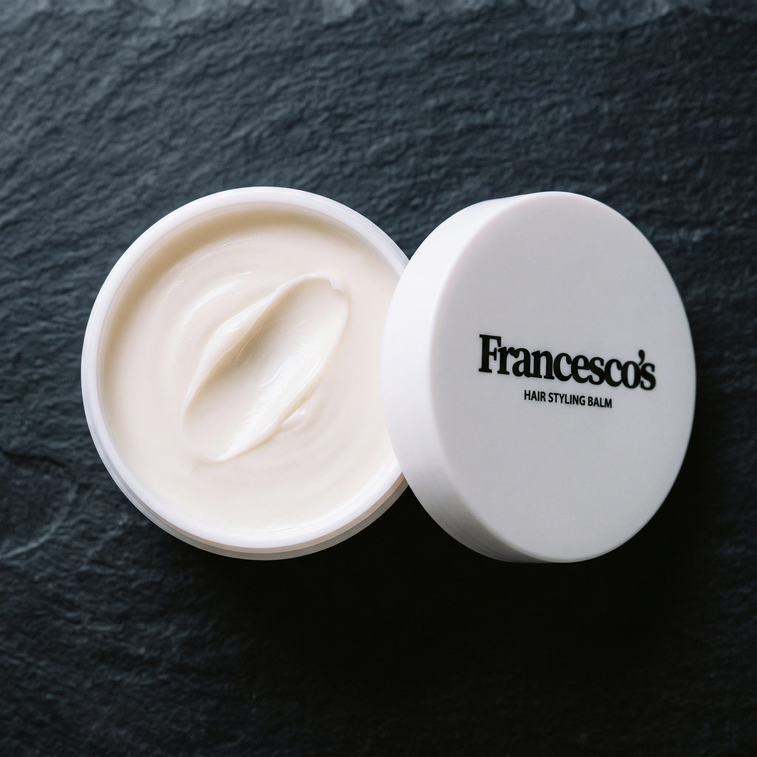 Open jar of balm from above